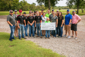 YF&R shotgun shoot pose with mock check.